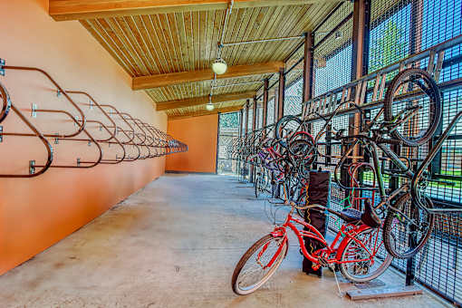 A bike rack with many bikes parked.
