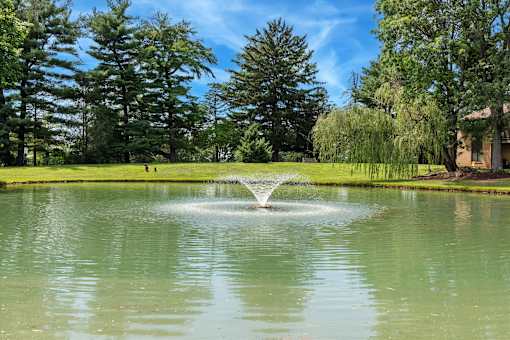 Fountain in middle of pond at The Lakes, Allentown, Pennsylvania