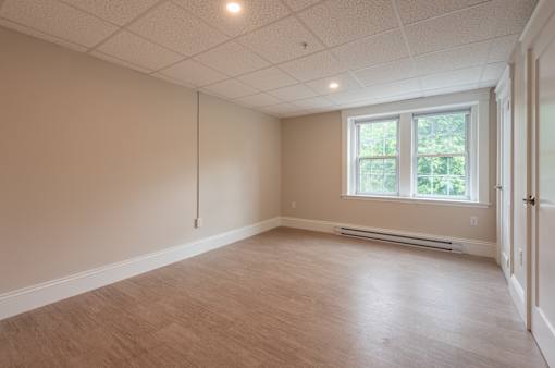A room with a window and a door.