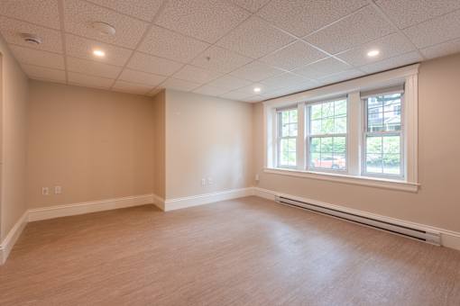 A room with a window and a white ceiling.