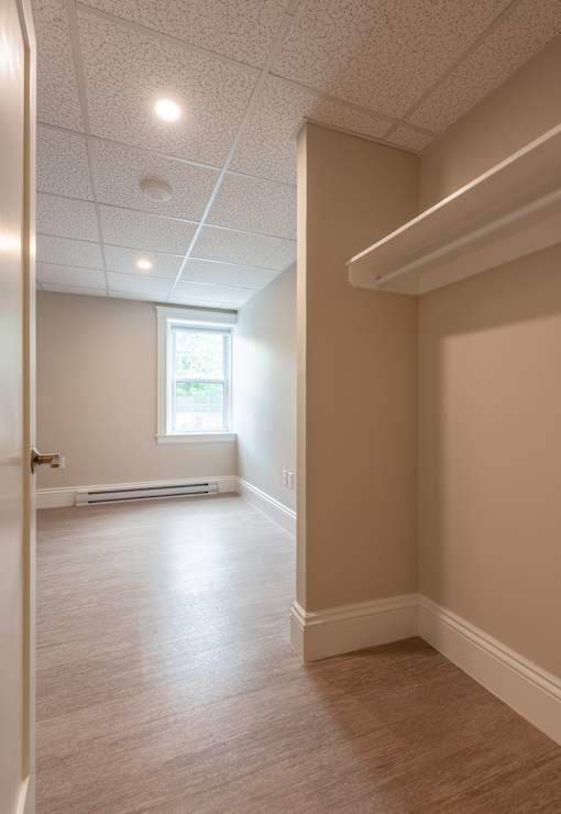 A room with a window and a door.