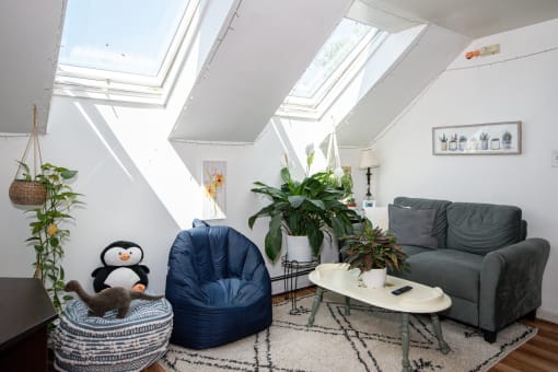 a home with a 16 foot ceiling and skylights