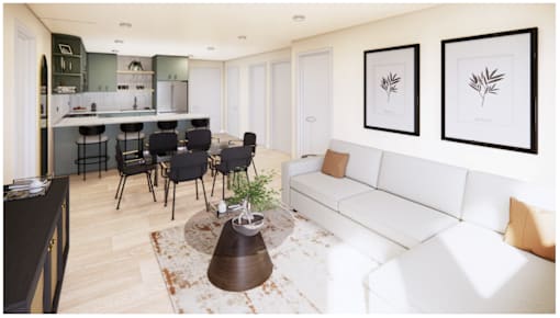 A modern living room with a white sofa and a kitchen area in the background.