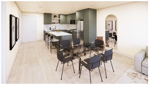 A modern kitchen with a dining table and chairs.