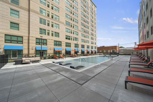 a large swimming pool in front of a large building at The Icon, Richmond, VA 23230