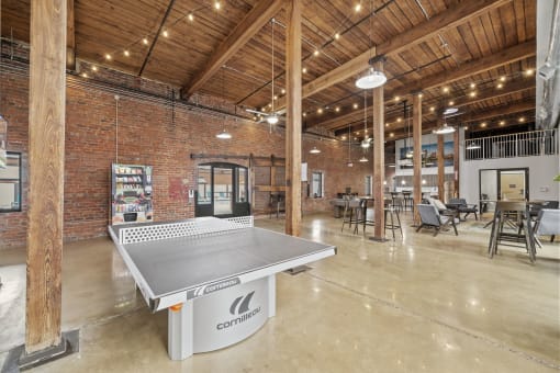 a ping pong table sits in the middle of the space