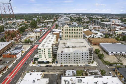 arial view of a city with a red train on the tracks at The Icon, Richmond, VA 23230