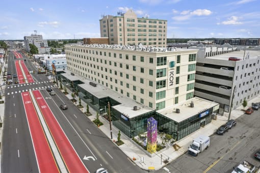 a large white building with a sign that says motel 6 on the side of it at The Icon, Richmond, VA 23230