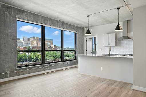 A kitchen with a view of the city.