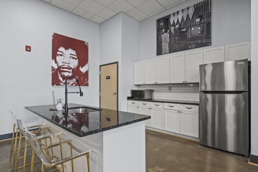 a kitchen with a countertop and a refrigerator  at The Icon, Richmond, VA 23230