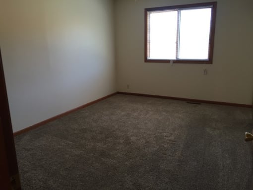 Bedroom with wooden flooring at Dutch Hills Terrace Apartments, Parkersburg, WV