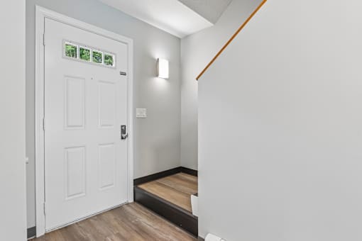 A white door with a glass window above it.
