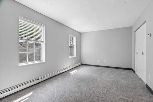 A room with a window and a door.