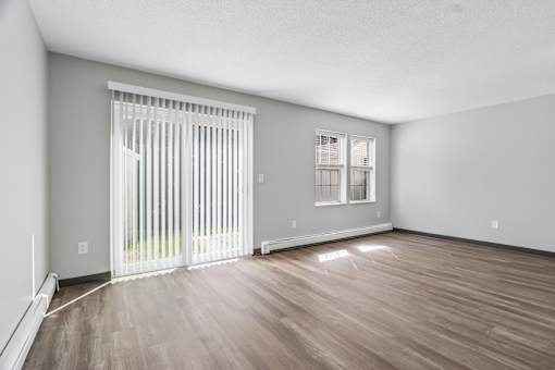 A room with a sliding door and a window.