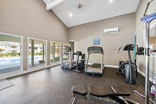 A gym with treadmills, exercise bikes, and a sign that says "Centre".