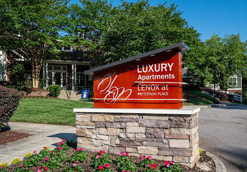 A sign for Luxury Apartments at Lenox at Paterson Place.