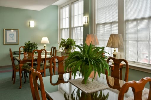 a large dining room with a table and chairs