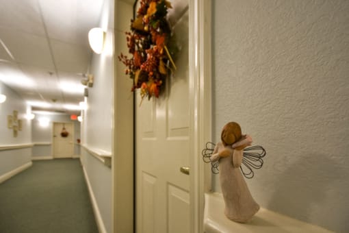 a door with a figurine of a angel on the door