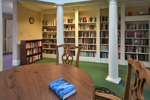 a table in a library with books on it