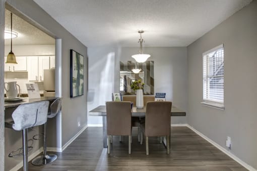 an open kitchen and dining room with a table and chairs