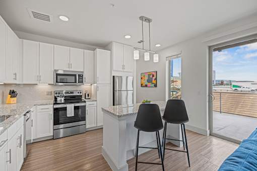 Kitchen with island at Placemakr Downtown Austin, Austin, 78701