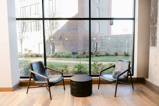 Two chairs and a table at Anthem House, Huntsville
