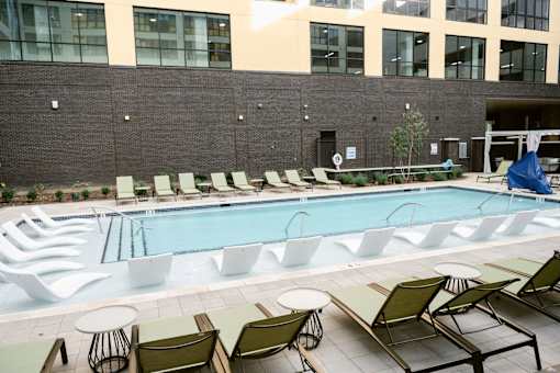 Pool surrounded by chairs at Anthem House, Alabama, 35806