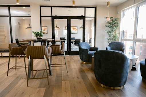 Room with a wooden floor and a large window at Anthem House, Huntsville, Alabama