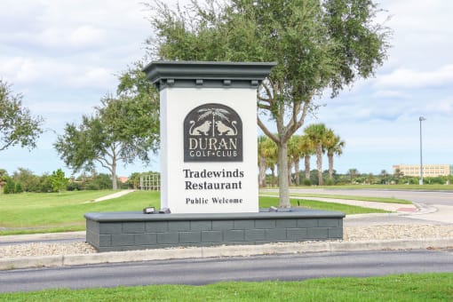 the sign for duran college on the side of the road