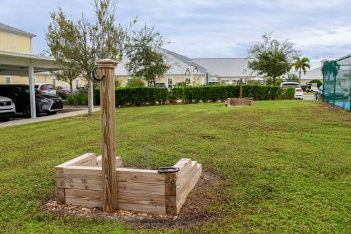 a wooden planter box in the middle of a lawn