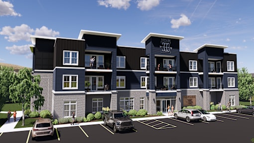 a rendering of a three story apartment building with cars parked in front of it