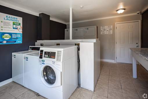 A laundry room with a washer and dryer.