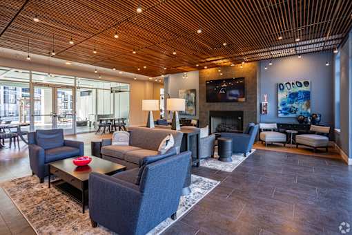 A living room with a fireplace and a television.