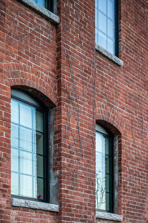 a red brick building with three windows
