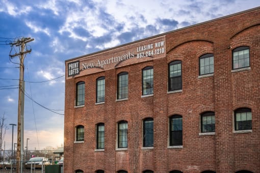 a red brick building with a sign that reads penn valley apartments