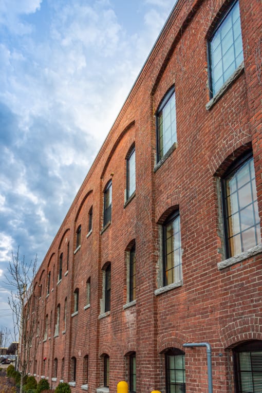 a red brick building with a blue sky in the background