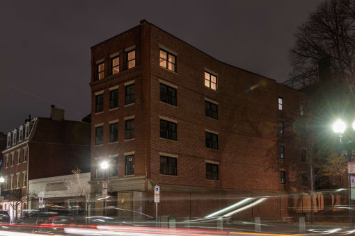 a red brick building at night
