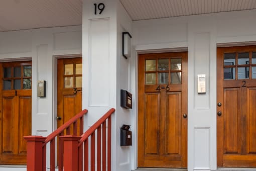 a row of wooden doors with numbers on them