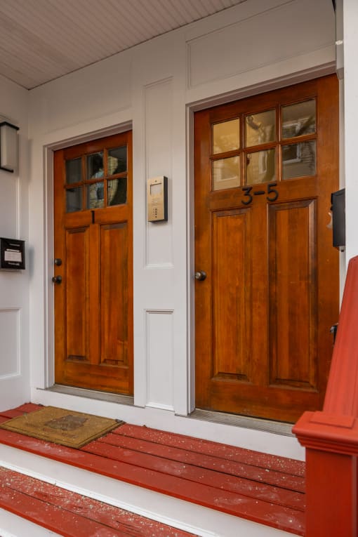 two wooden doors on a house