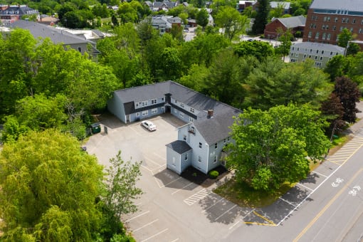 arial view of a large gray building with a gray roof