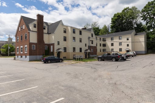 a parking lot in front of a large building
