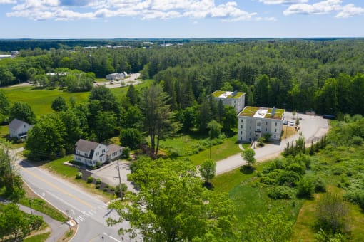 arial view of the house with green roof
