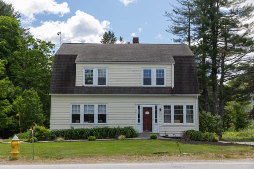 a house with a fire hydrant in front of it