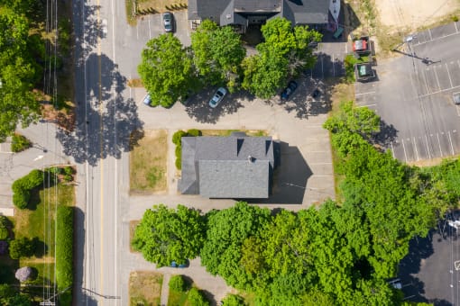 arial view of a house with a gray roof