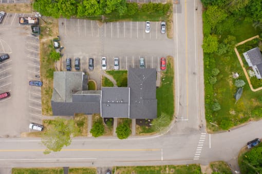 a bird's eye view of a house in a parking lot