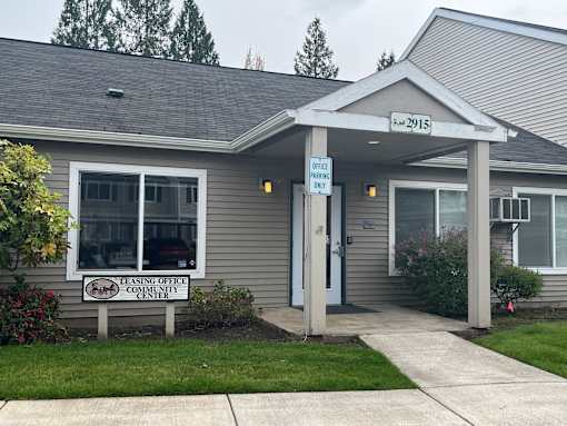 A building with a sign that says Leasing Office Community Center.