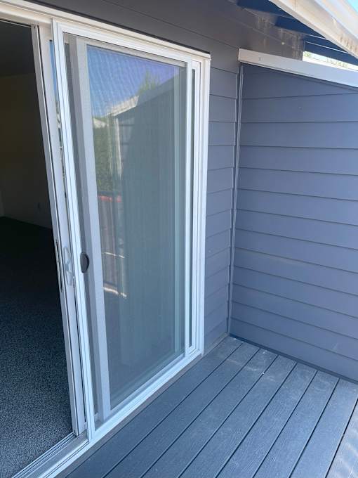 A sliding glass door on a deck.