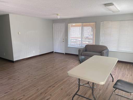 A room with a table and chairs in it.
