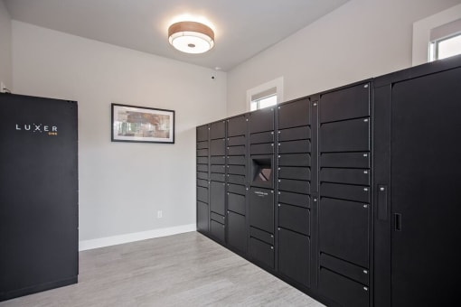 a room with several lockers and a picture on the wall