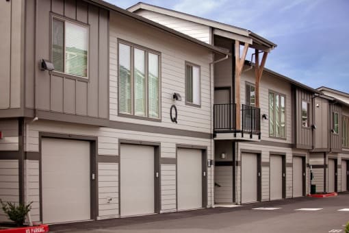 a row of garages in front of a building
